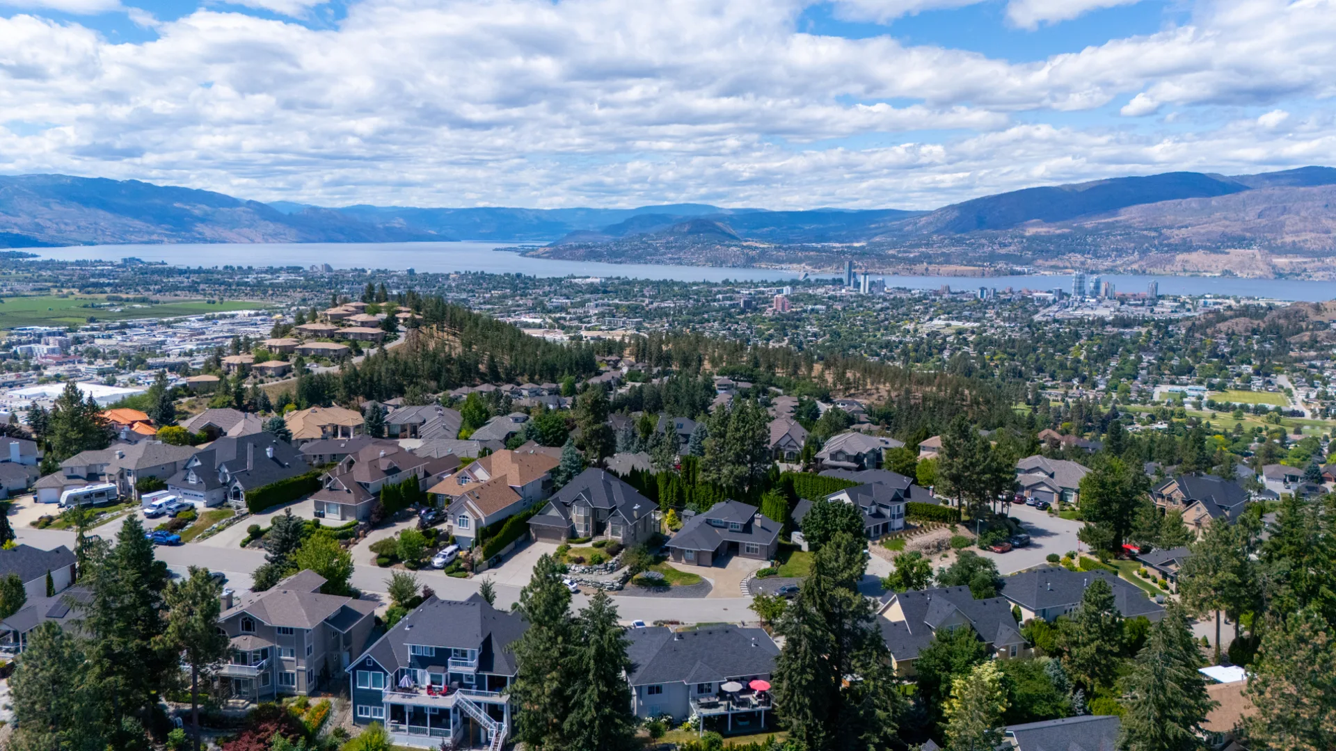 Aerial view of the Dilworth Mountain neighbourhood above downtown Kelowna and Okanagan Lake, British Columbia