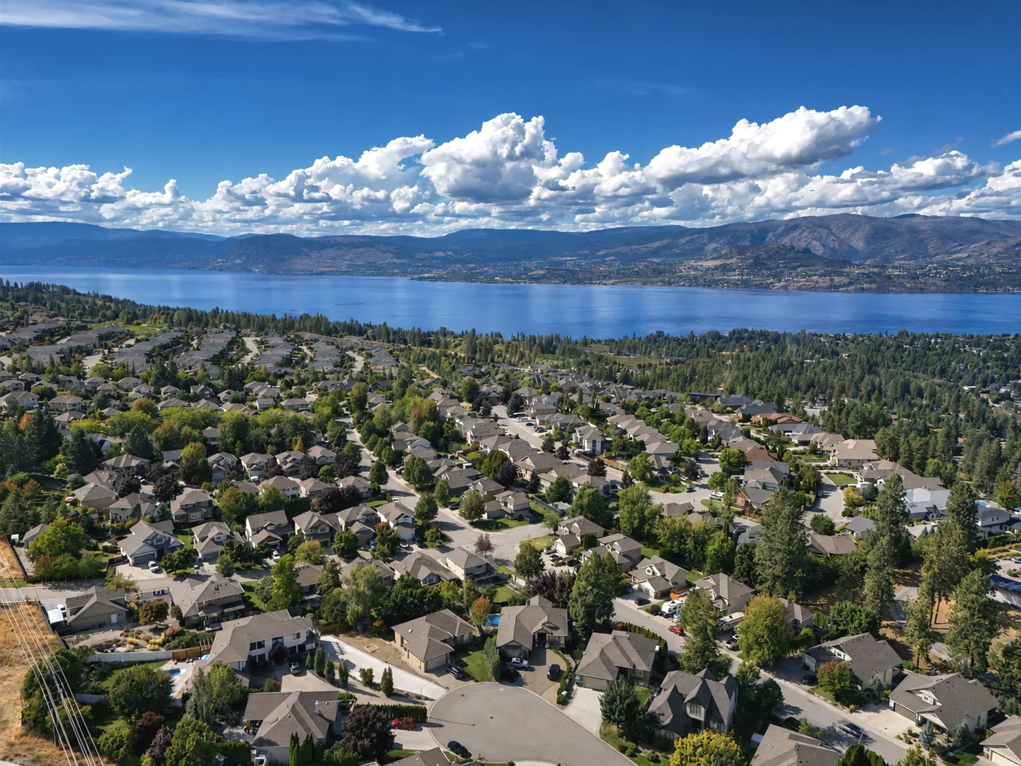 Aerial view of Upper Mission hillside homes above Okanagan Lake in Kelowna, British Columbia